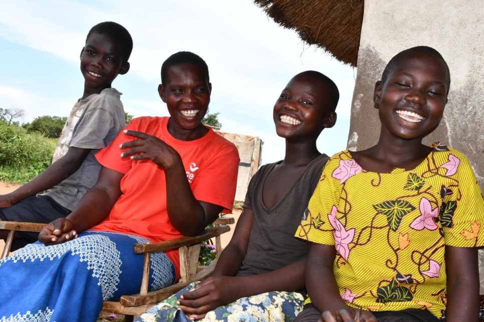 South Sudanese refugee Inga Viola sits outside her shelter with her children in Imvepi refugee settlement, Uganda. 