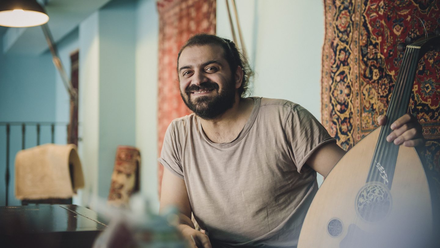 Romania. Mohammad Zatari, Syrian refugee is playing the oud, a t