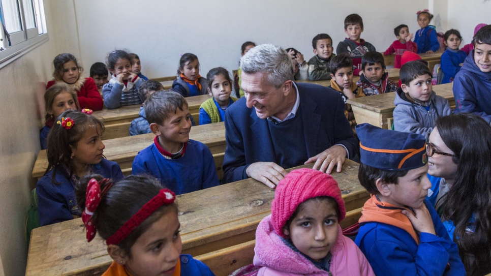 Filippo Grandi chats with pupils at the Al-Shuhada School in Souran, Syria.