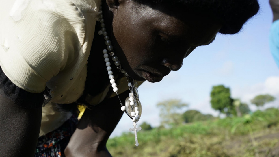 Queen, who fled conflict in South Sudan, tends to her crops in Uganda.