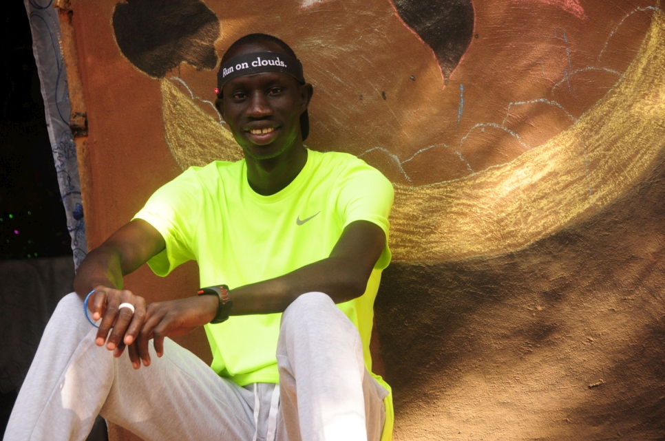 Kenya. James Nyang Enjoying rest outside his house