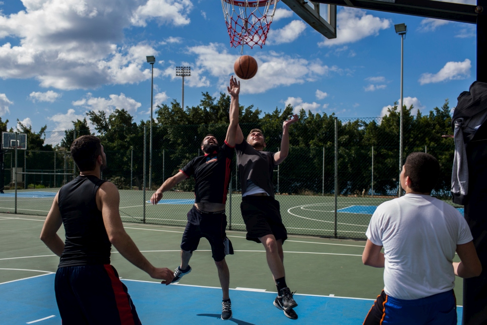 Syrian student Jankidar (second from left), plays basketball with friends at Lebanese University in Beirut. 