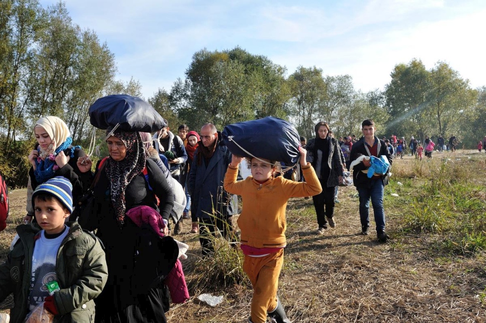 Refugees and migrants walk through a field in Slovenia after after crossing the border from Croatia in this 2015 file photo. 