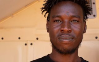 A man looks seriously at a camera in Niger