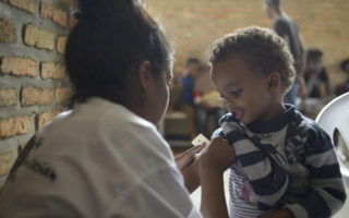 A small boy from Libya is seen by a doctor