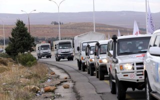 An aid convoy carrying food, medicine and blankets leaves the Syrian capital Damascus headed to the besieged town of Madaya on January 11, 2016