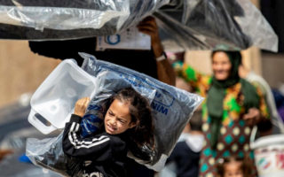 A girl from Syria flees her home