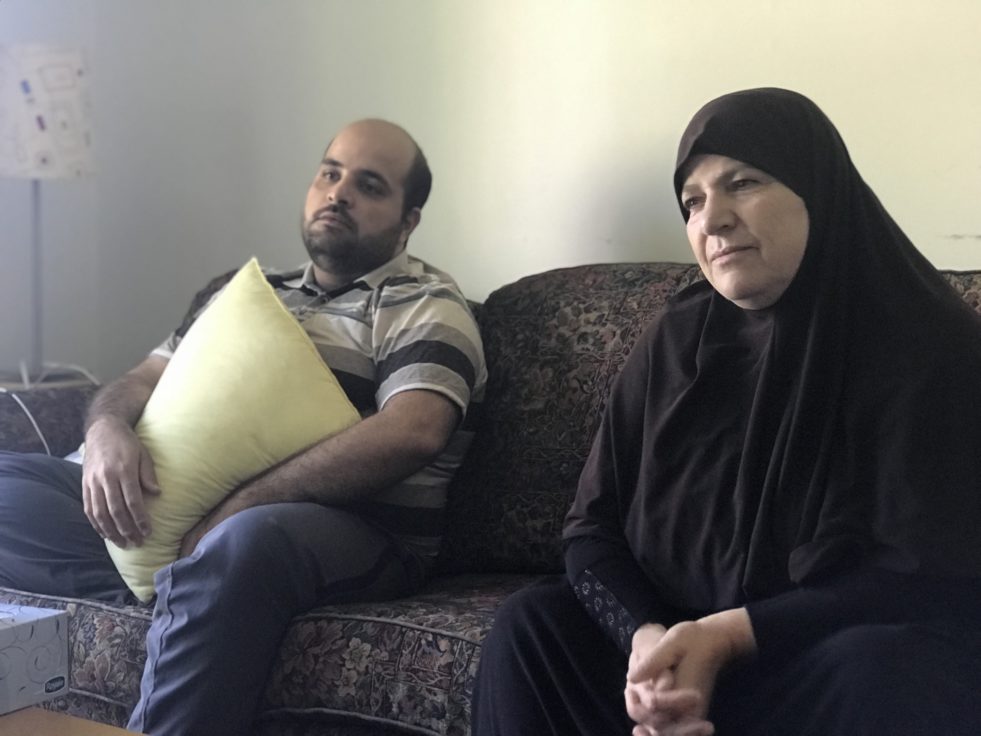 Man and woman sitting on couch 