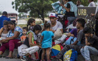 People from Venezuela sit and rest