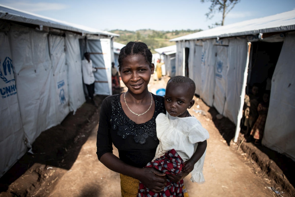 A woman from the Congo holds a baby.