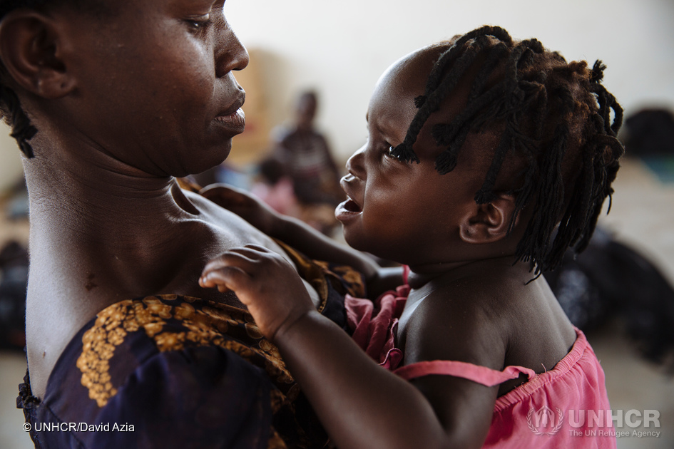 Mother Opani and daughter find safety in Uganda