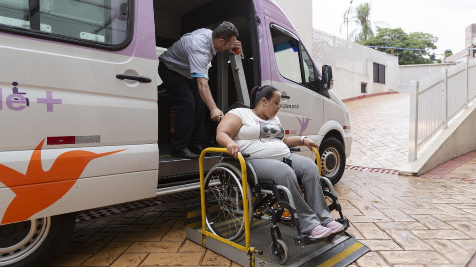 Gabriela Peña boards the van that takes her to and from her job in São Paulo, Brazil.