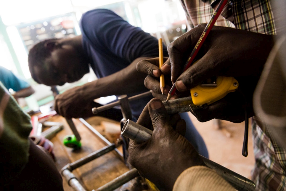 Refugees take tailoring classes in the Kakuma camp.