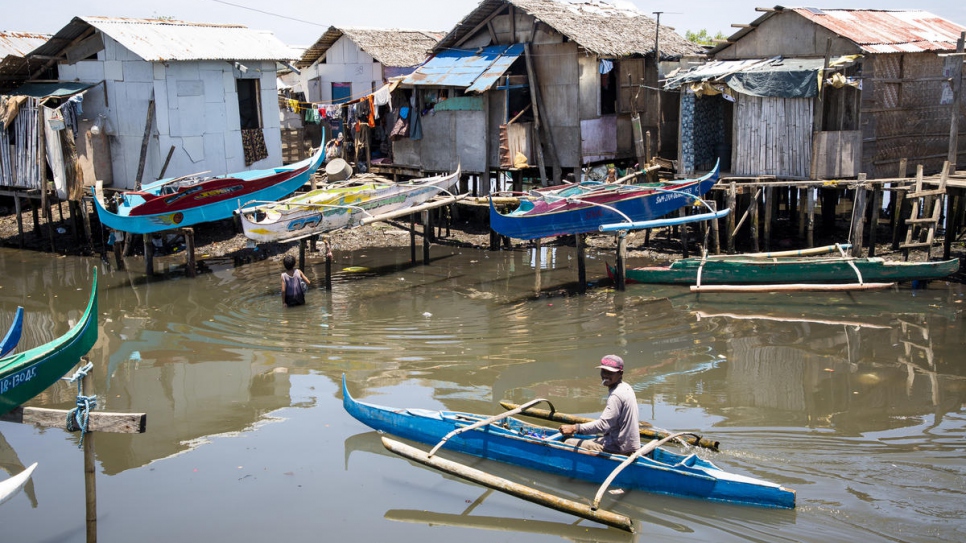 Residents go about their lives in the Valle Vista resettlement community near Zamboanga city, Philippines. The community comprises Sama Bajau and ethnic Tausug people.