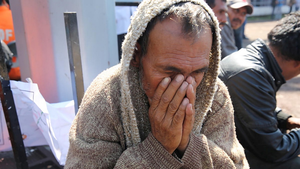 Antonio, 68, from Honduras rests at a temporary shelter in the Jesús Martínez "Palillo" stadium in Mexico City after a grueling journey.