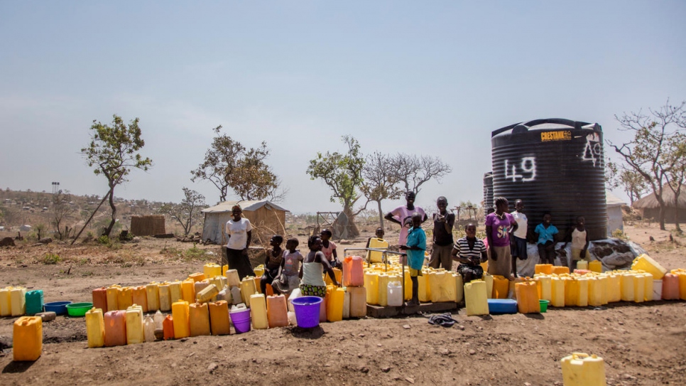 South Sudanese women at a water point in Rhino Camp refugee settlement in Uganda's Arua district where one in four people are refugees.