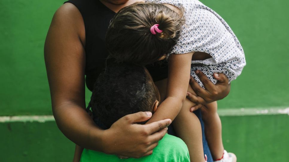 A mother holds her child at a shelter for refugees and asylum seekers in Tapachula, Mexico.