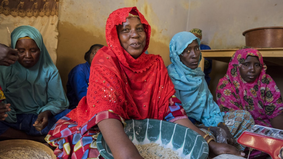 Mariam Souleye Maiga (in red) with a group of former refugees.