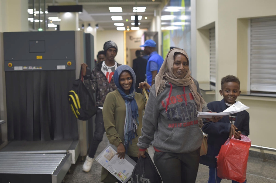 Refugees arrive in Kigalii, Rwanda after an evacuation flight form Libya