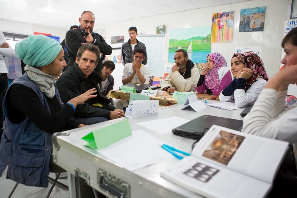 Ben speaks with refugees at the UNHCR-funded community center in Azraq refugee camp.