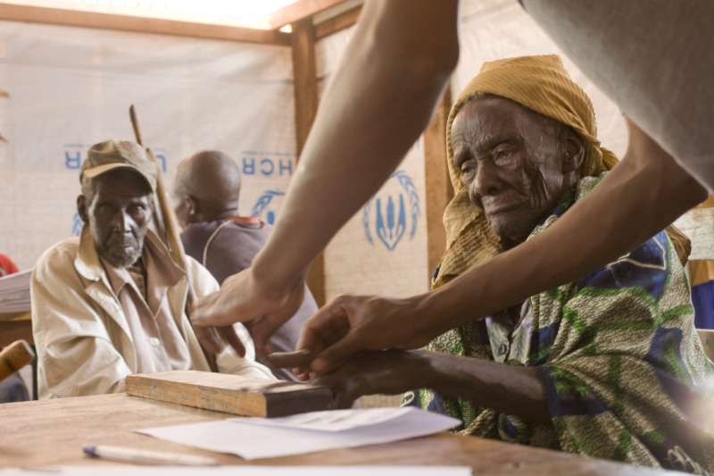 Tanzania / 1972 Burundian refugees / An old man and his wife, who fled to Tanzania in 1972, being fingerprinted as part of the naturalization application process. Ogeste Gelvasi also hopes to be naturalized. "My joy will be like a woman who has been pregnant for so long and has the pain, the labour of childbirth. Afterwards, she holds the thing she loves most and doesn’t feel the pain that passed. I will be the same when I get citizenship in Tanzania." UNHCR / B. Bannon / November 2008