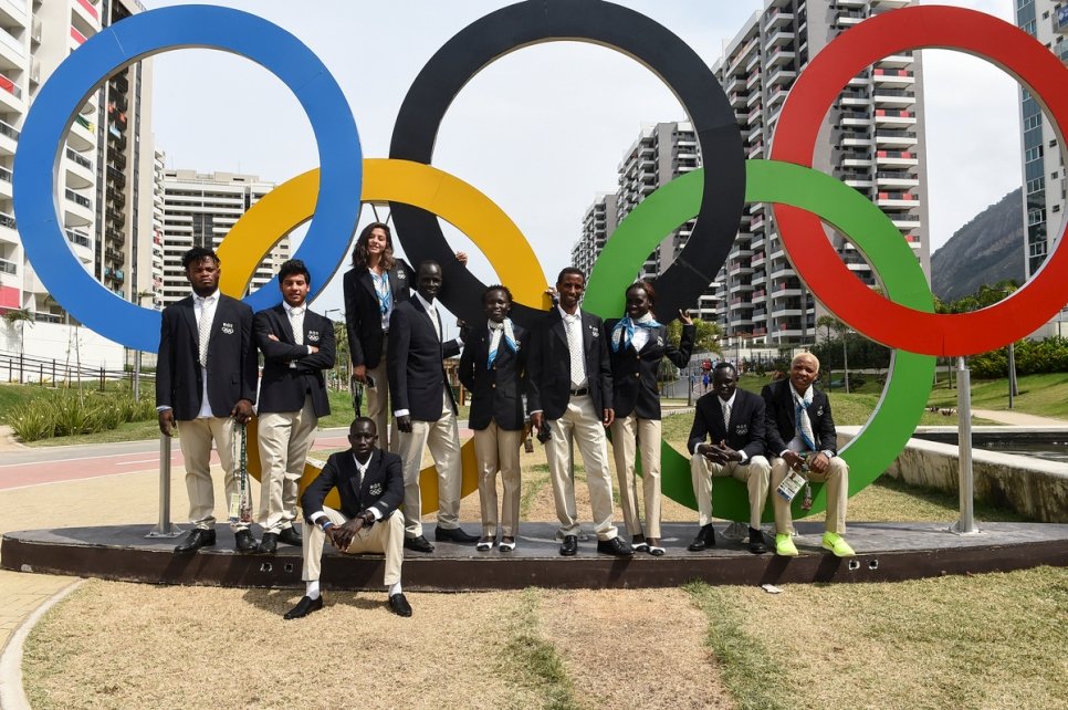 Members of the Refugee Olympic Team and their coaches pose for a photograph in the Olympic Village in Rio at the end of an exhausting and electrifying 2016 Games.