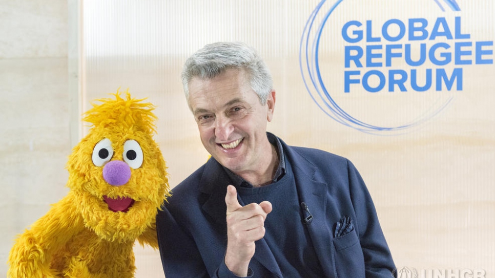 UN High Commissioner for Refugees Filippo Grandi meets Jad from Sesame Street, who is visiting the Global Refugee Forum in Geneva.
