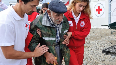 The Former Yugoslav Republic of Macedonia. Syrian refugee, Ismail Ibrahim assisted by the Red Cross at Vinjug Reception Centre