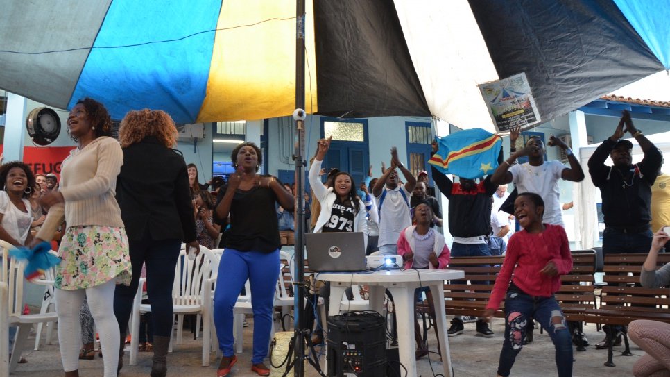 Congolese refugees in Rio cheer for Yolande and Popole as they compete the Olympics.