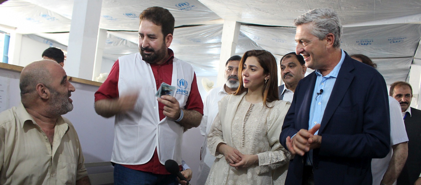 At UNHCR's Voluntary Repatriation Centre in Nowshera, near Peshawar, Pakistan, the High Commissioner for Refugees and UNHCR Goodwill Ambassador, Mahira Khan, observes as Afghan refugees go through a process for their voluntary return to Afghanistan.
