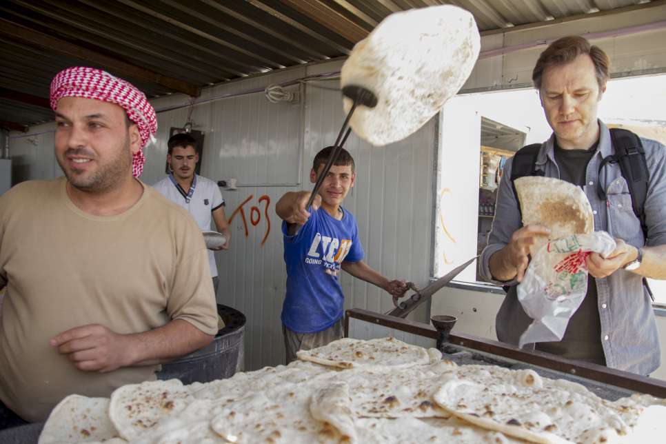 David Morrissey UNHCR High profile supporter buys bread from a bakery on Za'atri's Avenue des Champs Elysees