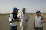 UNHCR Goodwill Ambassador Julien Clerc discusses the refugee situation with the UN High Commissioner for Refugees, Ruud Lubbers, and another UNHCR official in AbÃ©chÃ©, eastern Chad. March 2, 2004.