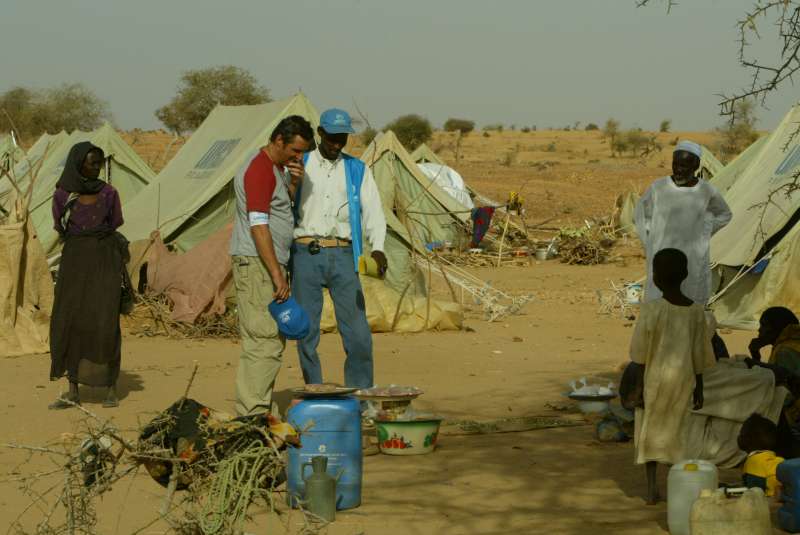 UNHCR Goodwill Ambassador Julien Clerc sees the living conditions of Sudanese refugees in Kounoungo camp, eastern Chad. March 3, 2004.