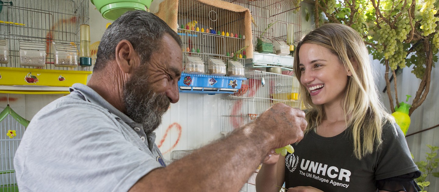 UNHCR High Profile Supporter Dianna Agron meets Syrian refugee Abu Aham who lives in Zaatari refugee camp (Jordan) with his wife and their 15 year old son, 2 widowed daughters-in-law, and 5 grandchildren. Their 2 eldest sons were killed in Syria.