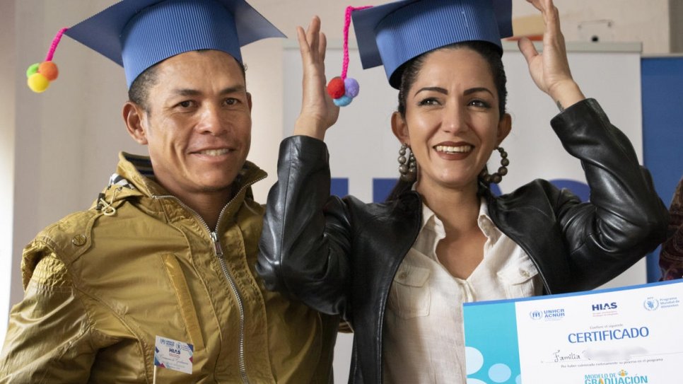 Venezuelans Osmar and Valeria at the ceremony marking the end of their participation in a training program aimed at giving them the skills to provide for themselves in their new home, Ecuador.  