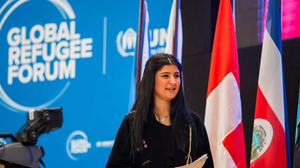 Aya Mohammed Abdullah, a former Iraqi refugee now living in Switzerland, addresses delegates at the Global Refugee Forum..