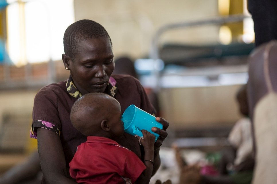 A refugee from South Sudan feeds her child at the stabilization centre in the Kakuma Refugee Camp Hospital, Kenya. 