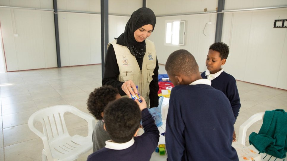 Psychotherapist Nadia Tabet interacts with the children.