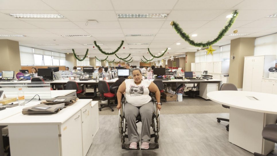 Gabriela Peña in the office where she works in São Paulo, Brazil. She found the job after being relocated from the border state of Roraima.