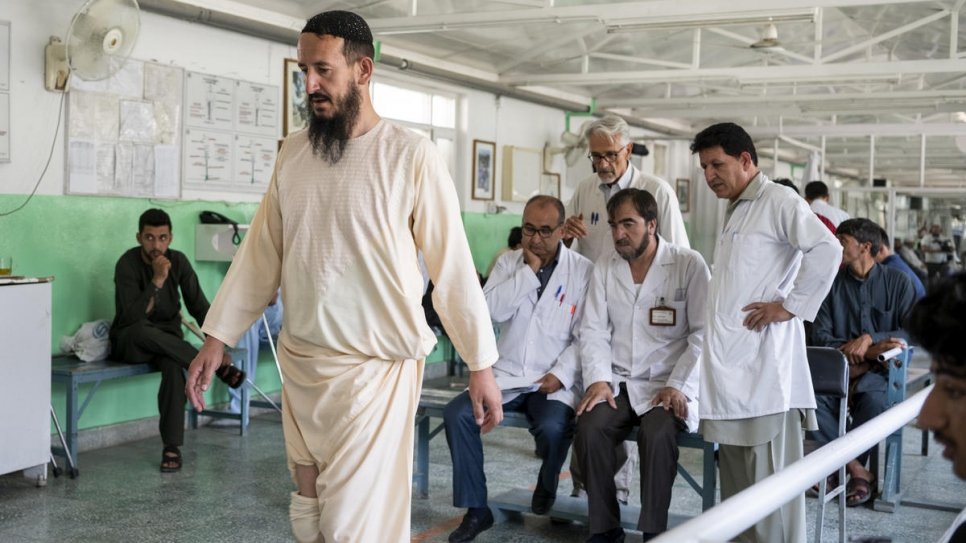 Afghan nurse Fahim receives physical therapy at the ICRC orthopaedic centre in Kabul, Afghanistan. He was 11 when a landmine explosion took one of his legs. 