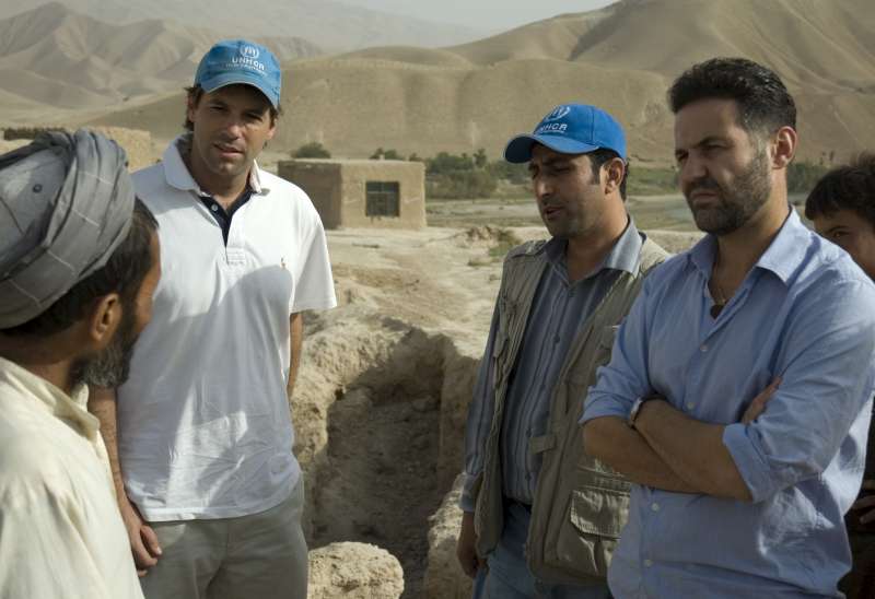 Khaled Hosseini tours a UNHCR shelter project with humanitarian project officer, Alex Mundt, in Kunduz. Those living here returned from Iran three years ago.