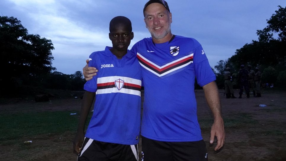 Patrick Amba, 14, with coach Marco Bracco from Sampdoria after the three-day training camp.