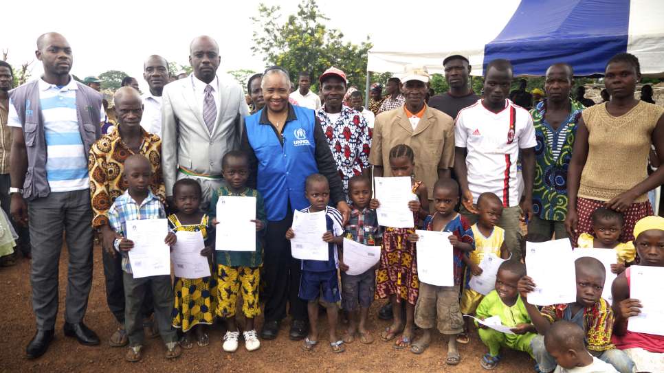 Standing with the villagers of Dronguine, Cote D'Ivoire. Their children had just been given their birth certificates. Without documents they would risk being Stateless. July 2014