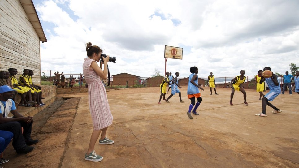 Helena captures a basketball match in Mahama refugee camp where both boys and girls are playing together.