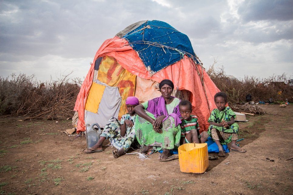 A family displaced within Somalia by drought sits beside a makeshift shelter in Wajaale district, June 2017.