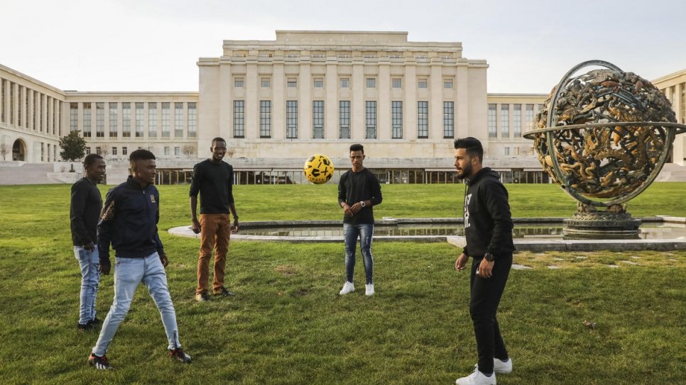 Refugees and asylum seekers attending events around the Global Refugee Forum play football at the Palais des Nations.