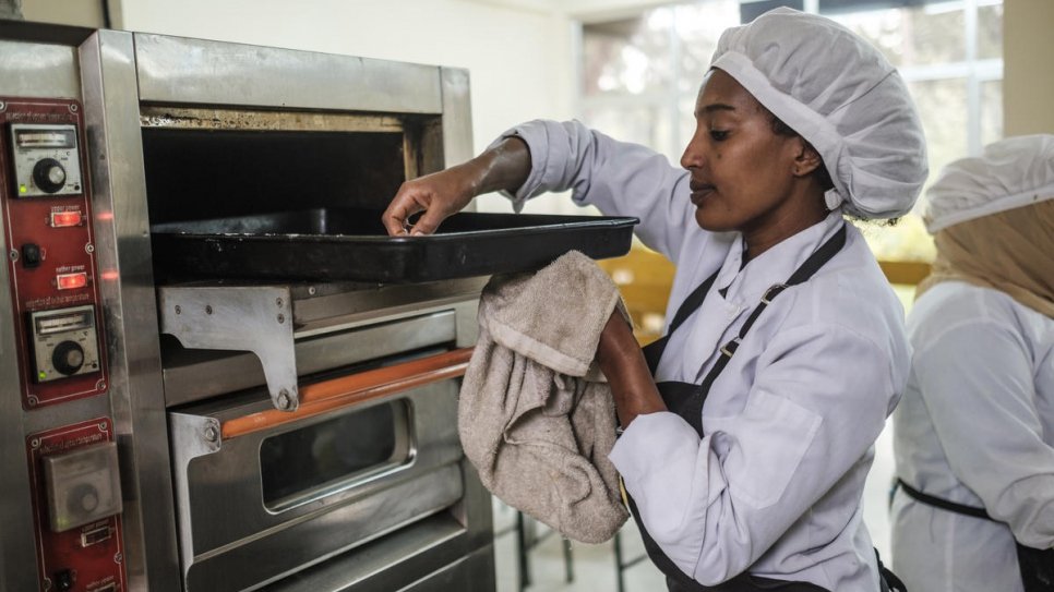 Yanchinew, an Ethiopian woman, prepares food as part of a cooking course for nationals and refugees at Nefas Silk Polytechnic College in Addis Ababa, Ethiopia.