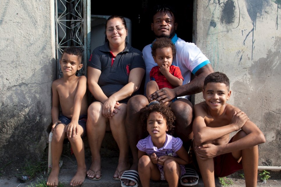 Brazil. A Congolese Olympic judoka and his family outside their home in Rio de Janeiro