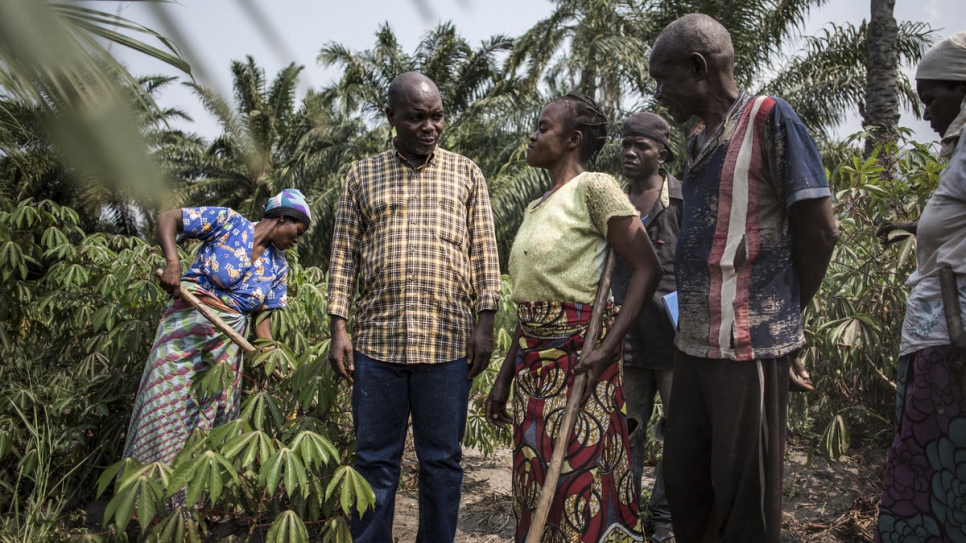 Congolese human rights activist, Evariste Mfaume, talks to beneficiaries of his agricultural project at Lusenda refugee camp.