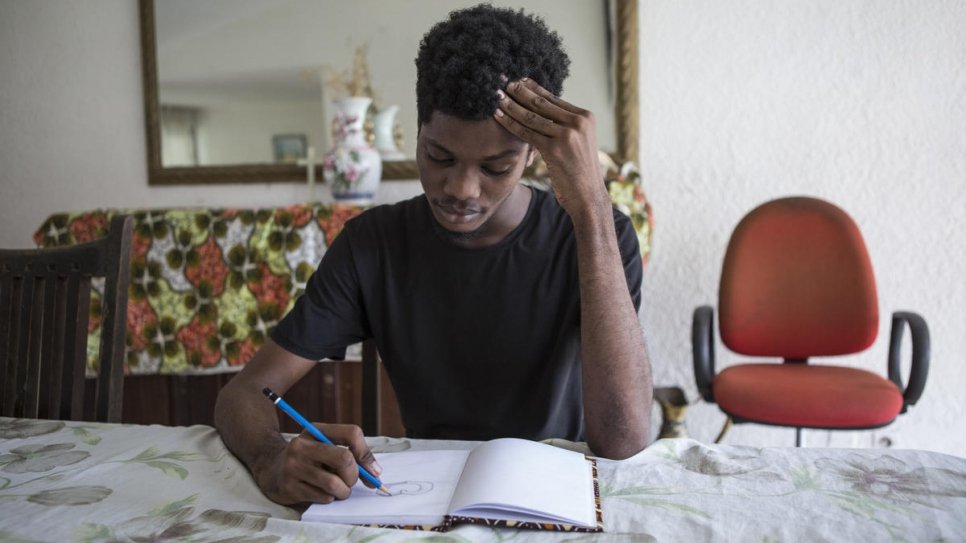 Ivorian graphic designer O'Plérou develops his emojis as sketches on paper before he designs them on the computer.